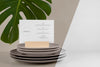 Menu Mock-Up With Monstera Leaf And Dishes Psd