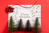 Merry Christmas Mock-Up Paper With Pine Trees Psd