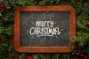 Merry Christmas On Chalkboard And Christmas Pine Leaves Psd