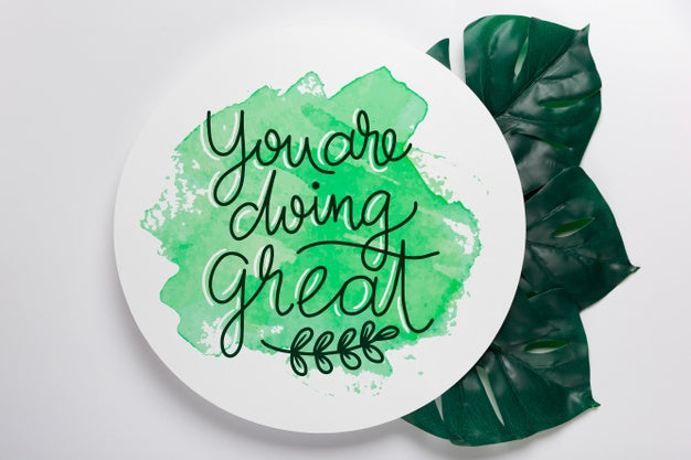 Message On Geometric Paper Shape Above Leaves Psd