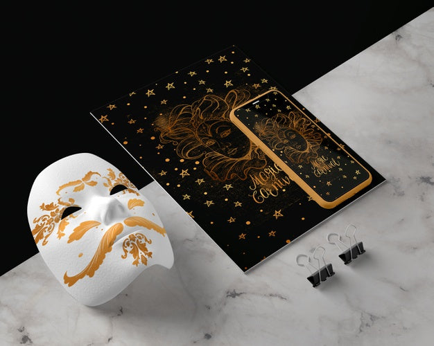 Mobile Beside Golden Mask On Table Psd