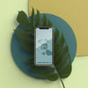 Mobile On 3D Leaf On Table Psd