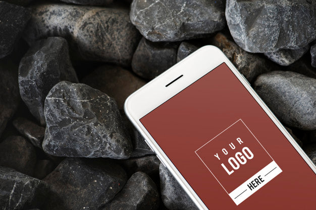 Mobile Phone On A Rocky Surface Psd