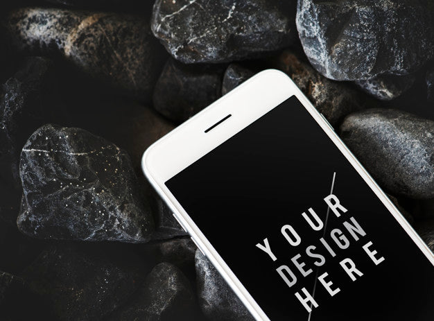 Mobile Phone On A Rocky Surface Psd