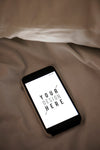 Mobile Phone Screen Mockup On Sheet Surface Psd