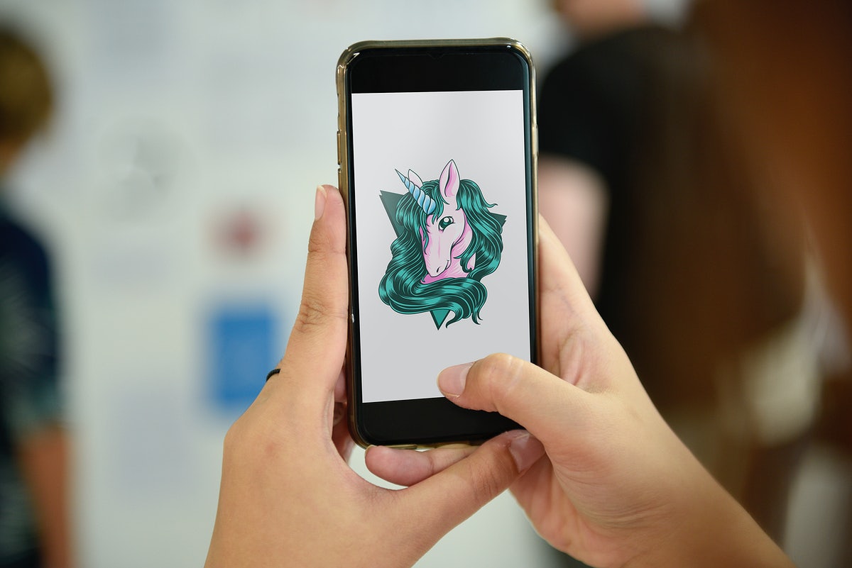 Mobile Phone Showing Unicorn Graphic