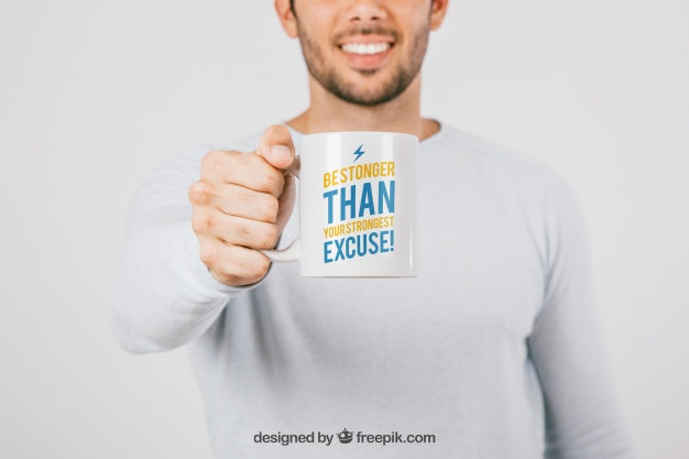 Man Holding a Blank Coffee Mug Mockup