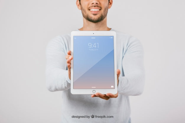 Mock Up Design With Man Holding Vertical Tablet Psd