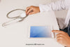 Mock Up Design With Medical Doctor Working With Tablet Psd
