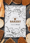Mock-Up Frame Of Bread With Notebook Psd
