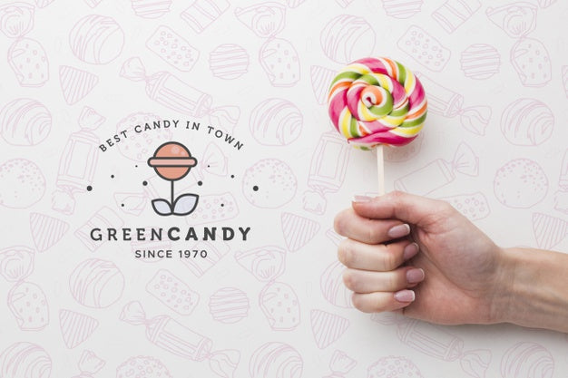 Mock-Up Hand With Tasty Lollipop Psd