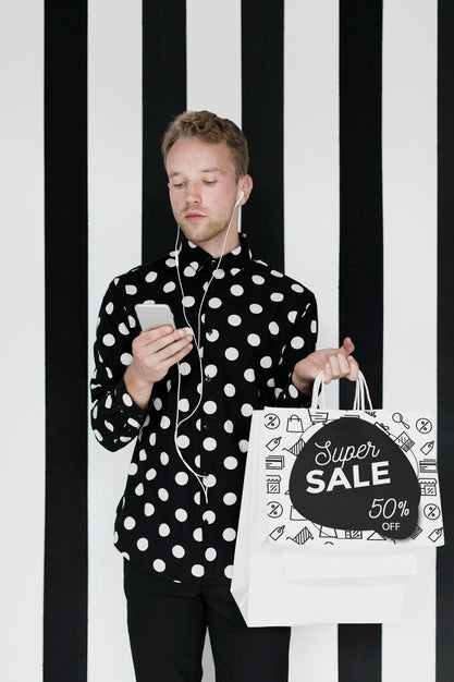 Mock-Up Handsome Man Holding Shopping Bags Psd