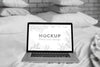 Mock Up Laptop In Bedroom Psd