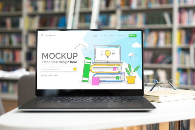 Mock-Up Laptop On Table In Library Psd