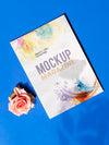 Mock Up Magazine And A Rose On Blue Background Psd
