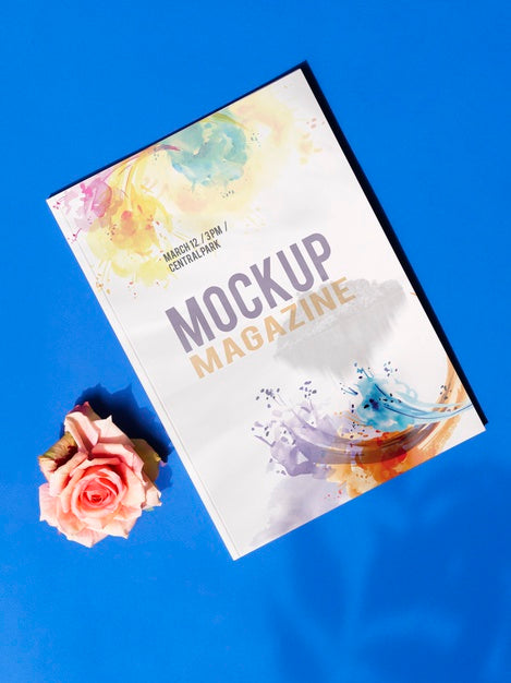 Mock Up Magazine And A Rose On Blue Background Psd
