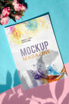 Mock Up Magazine Next To A Bouquet Of Roses Psd
