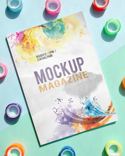 Mock Up Magazine Next To Tape Rolls Psd