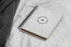 Mock Up Notebook On Bed Psd