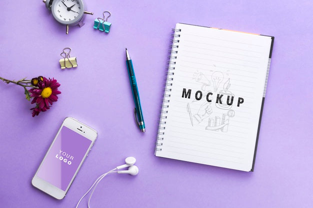 Mock-Up Notebool And Clock On Table Psd