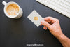 Mock Up Of Hand Holding Business Card With Coffe And Keyboard Psd