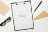 Mock-Up Paper On Black Clipboard Psd