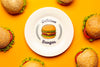 Mock-Up Plate Surrounded By Delicious Burgers Psd