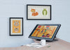 Mock-Up With Artistic Painting On Wall And Desk Psd