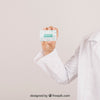Mock Up With Doctor'S Hand Holding A Visiting Card Psd