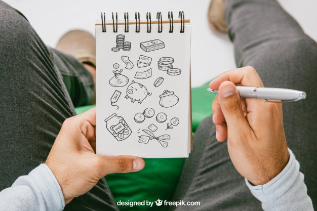 Mock Up With Hands Drawing On The Notebook Psd