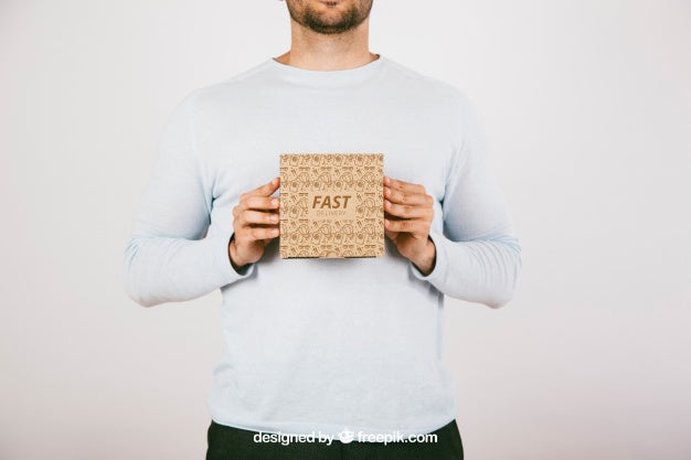 Mock Up With Man Holding A Carton Box Psd