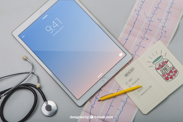 Mock Up With Tablet, Stethoscope, Cardiogram And Notebook Psd