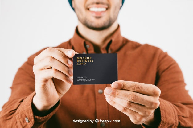 Mock Up With Young Man And Business Card In Foreground Psd