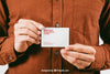 Mock Up With Young Man'S Hands Holding Business Card Psd