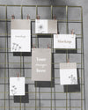 Mockup Cards Hanging On Grid Wire Board Psd