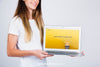 Mockup Concept Of Woman Holding Laptop Psd