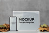 Mockup Devices Standing On The Table Next To Leaves Psd
