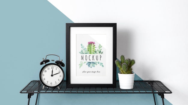 Mockup Frame On Table Beside Clock Psd