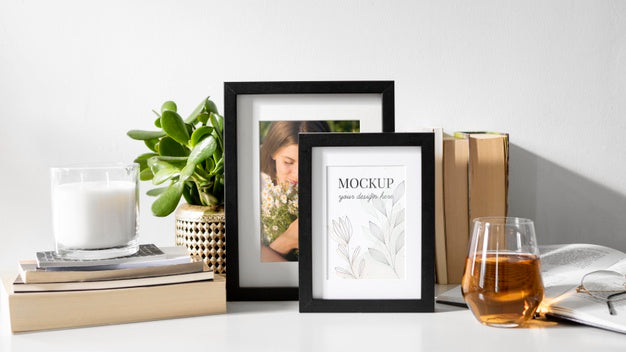 Mockup Frame On Table Beside Plants Psd