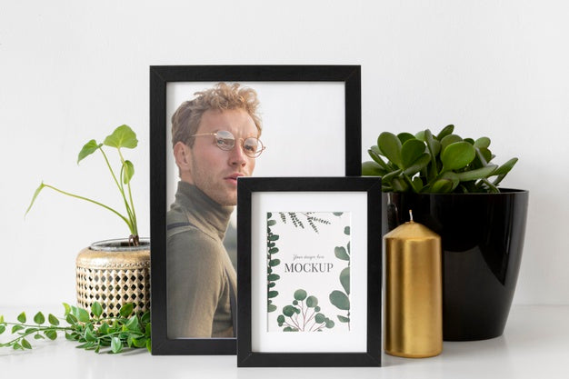 Mockup Frame On Table Beside Plants Psd