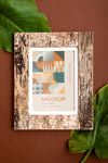Mockup Frame On Wall With Leaves Psd