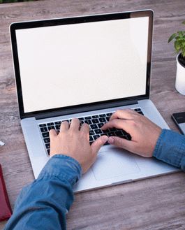 Mockup: Male Lancer Working On Macbook