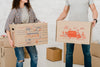 Mockup Of Couple With Cardboard Boxes Psd