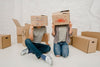 Mockup Of Couple With Cardboard Boxes Psd