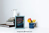 Mockup Of Frame Next To Stack Of Books Psd