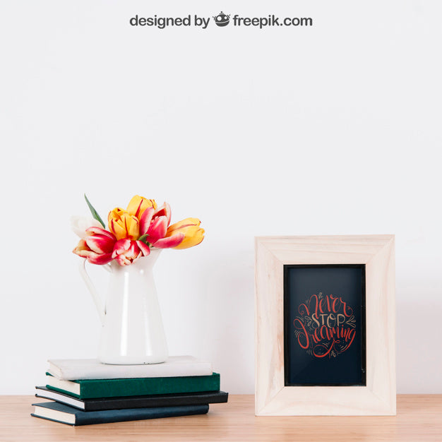 Mockup Of Frame Next To Three Books Psd
