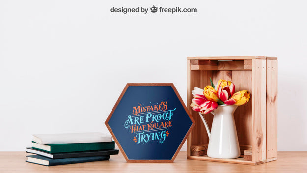 Mockup Of Frame On Desk With Books And Plant Psd