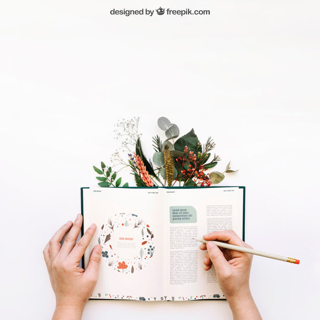 Mockup Of Hands Writing In Book Psd