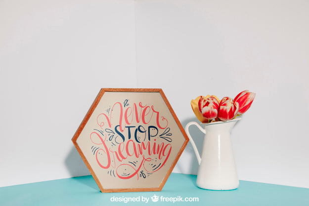 Mockup Of Hexagonal Frame Next To Flowers Psd