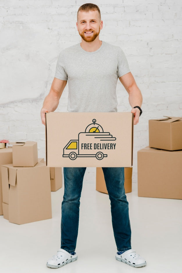 Mockup Of Man With Cardboard Boxes Psd